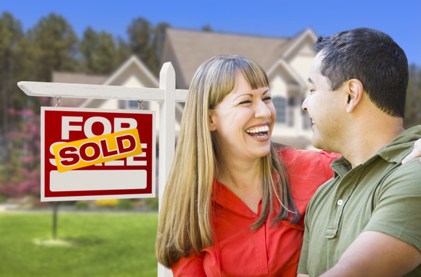 Couple in Front of Sold Real Estate Sign and House - Foto, Imagen