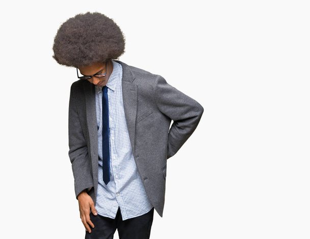 Young african american business man with afro hair wearing glasses Suffering of backache, touching back with hand, muscular pain - Foto, Imagen
