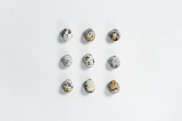 Quail egg. White background, top view, space for text - Фото, зображення