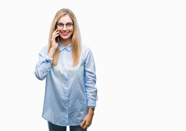 Young beautiful blonde business woman calling on smartphone over isolated background with a happy face standing and smiling with a confident smile showing teeth - Valokuva, kuva