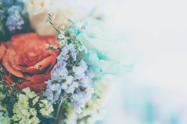 Selective focus of beautiful colorful flower bouquet with summer bokeh background.vintage fade color style. - Photo, Image