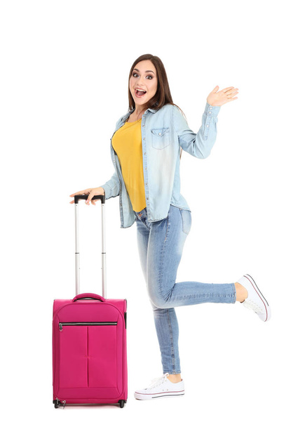 Young girl with suitcase isolated on white background - Fotoğraf, Görsel