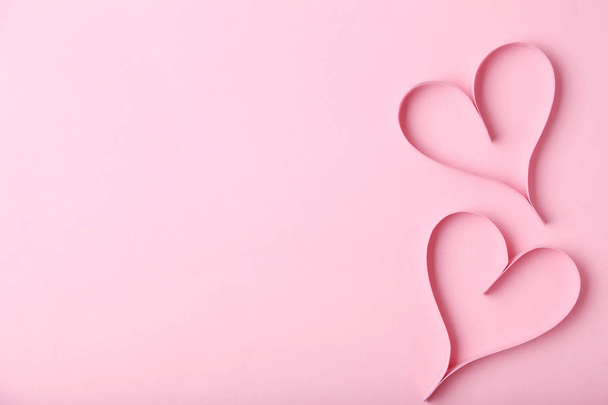 Paper hearts on pink background - Фото, зображення