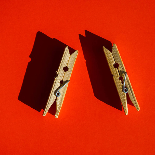 pair of pegs is on an orange background - Fotografie, Obrázek