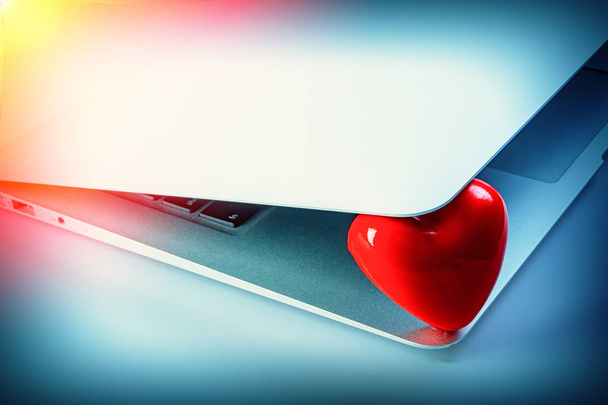 Valentine Heart and a laptop. Valentine's Day. February 14.  - Φωτογραφία, εικόνα