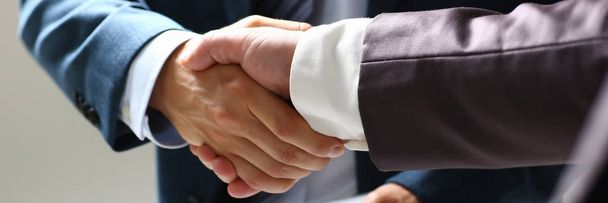 Man in suit shake hand as hello in office closeup - Foto, afbeelding