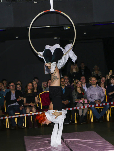 YOSHKAR-OLA, RUSSIA, DECEMBER 08, 2018: Dance and acrobatic show - love is 2018, from CrazyPole dance and aerial acrobatics Studio - Foto, afbeelding