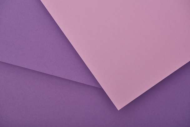 top view of lilac and violet laid out paper sheets with copy space - Фото, изображение
