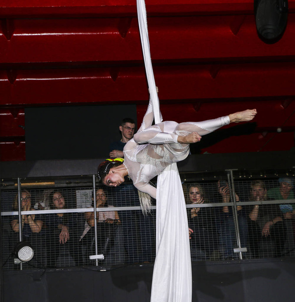 YOSHKAR-OLA, RUSSIA, DECEMBER 08, 2018: Dance and acrobatic show - love is 2018, from CrazyPole dance and aerial acrobatics Studio. - Fotó, kép