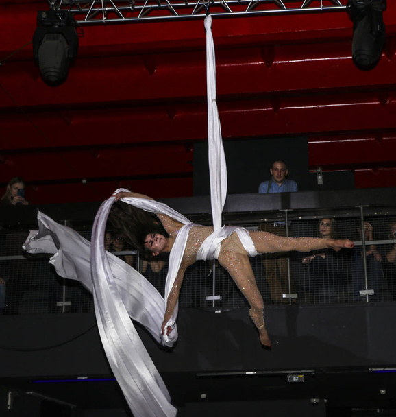 YOSHKAR-OLA, RUSSIA, DECEMBER 08, 2018: Dance and acrobatic show - love is 2018, from CrazyPole dance and aerial acrobatics Studio. - Φωτογραφία, εικόνα