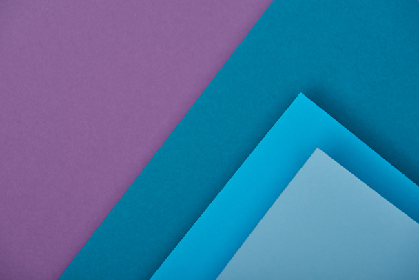 vista superior de hojas de papel púrpura y azul con espacio de copia
 - Foto, imagen