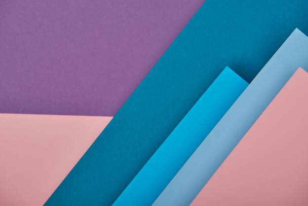 top view of blue, pink and violet paper sheets with copy space - Photo, Image