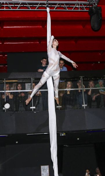 YOSHKAR-OLA, RUSSIA, DECEMBER 08, 2018: Dance and acrobatic show - love is 2018, from CrazyPole dance and aerial acrobatics Studio. - Foto, immagini