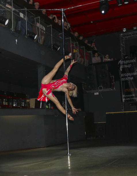 YOSHKAR-OLA, RUSSIA, DECEMBER 08, 2018: Dance and acrobatic show - love is 2018, from CrazyPole dance and aerial acrobatics Studio. - Фото, изображение
