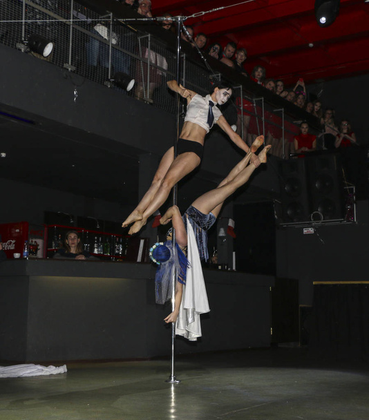 YOSHKAR-OLA, RUSSIA, DECEMBER 08, 2018: Dance and acrobatic show - love is 2018, from CrazyPole dance and aerial acrobatics Studio. - 写真・画像
