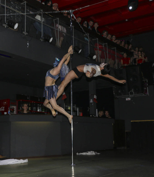 YOSHKAR-OLA, RUSSIA, DECEMBER 08, 2018: Dance and acrobatic show - love is 2018, from CrazyPole dance and aerial acrobatics Studio. - Zdjęcie, obraz