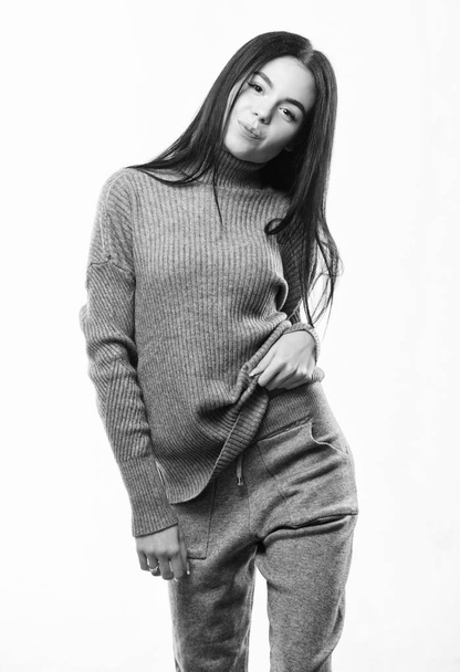 Female knitwear. Fashionable knitwear. Knitwear concept. Feel warm and comfortable. Woman wear grey textile suit blouse and pants. Warm comfortable clothes. Casual style fashion for every day - 写真・画像