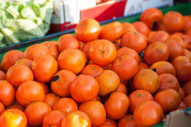 closeup of organic tangerines at the market  - Fotoğraf, Görsel