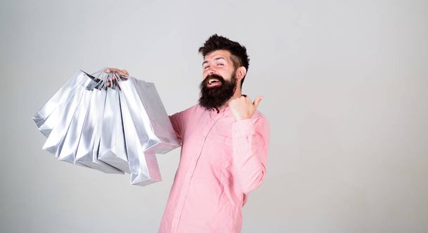 Shopping on black friday. Happy shopping with bunch paper bags. Profitable deal. Shopping addicted consumer. Total sale concept. Man bearded hipster with lot shopping bags. Could not resist discount - Φωτογραφία, εικόνα