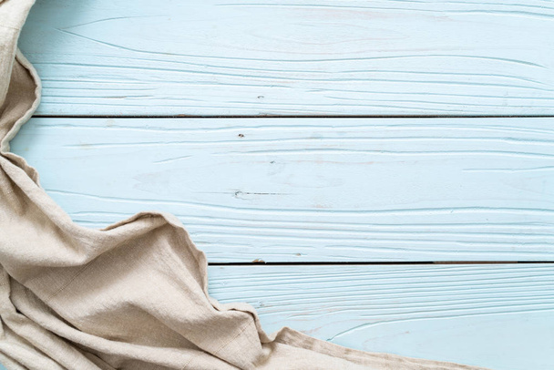 kitchen cloth (napkin) on blue wooden background with copy space - Valokuva, kuva