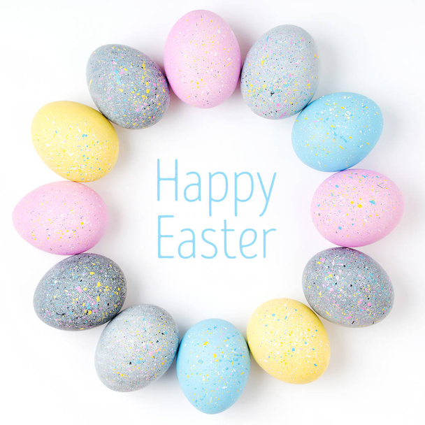 Stylish Frame of pale pink, blue and gray Easter eggs with copy space for text. Flat lay - Photo, image