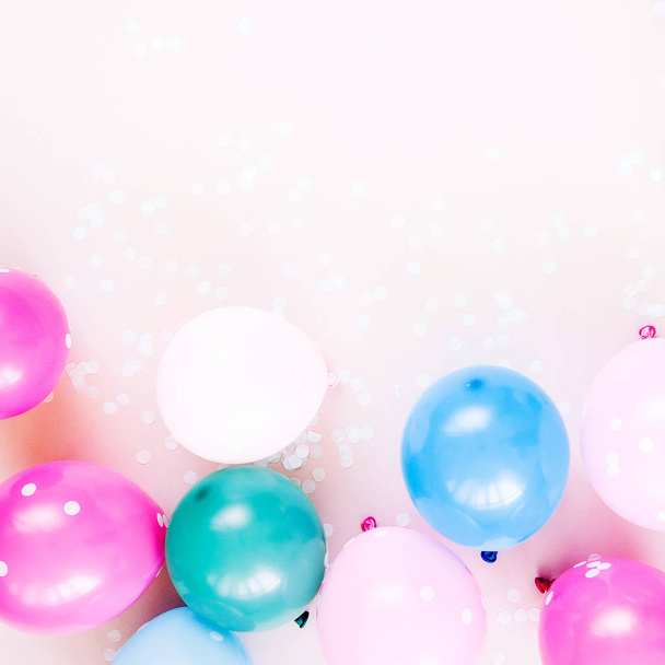 Colorful balloons on pastel color background. Festive or birthday party concept. Flat lay, top view. - Foto, Imagem