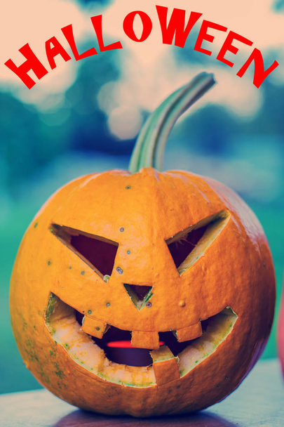 Scary Halloween pumpkin on a soft background and text - Фото, изображение