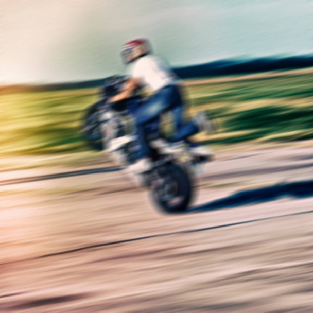 blurred background, the rider on the track at speed - Foto, Imagen