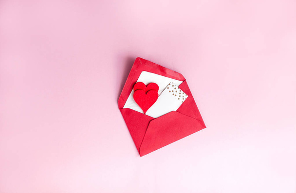 Valentine's day concept. Valentine, hearts, card on a pink background. Holidays. - Фото, зображення