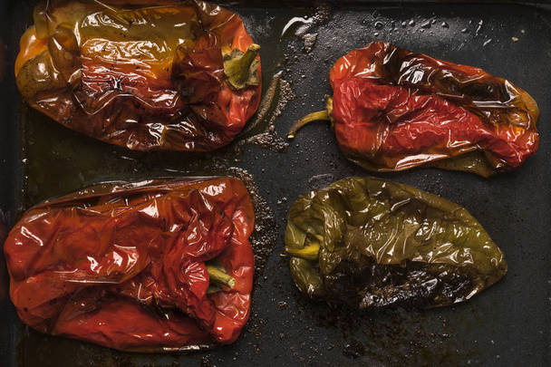 Flat lay of roasted red and green peppers ready to be served - Фото, изображение