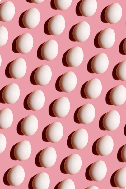 Abstract background with white eggs on pink  - Foto, immagini