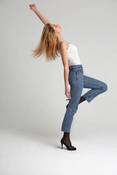 Full length test shooting for stylish young woman wears blue jeans and shirt - Foto, imagen