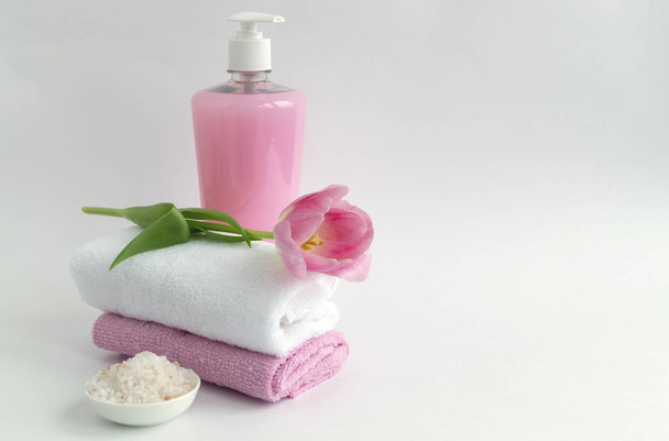 Liquid soap and two towels on a white background - Photo, image