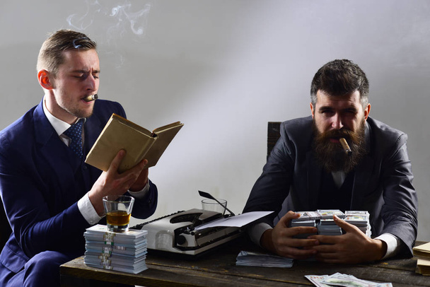 Our business. Money brokers counting profit increase. Successful investment in business. Businessmen write financial report while drinking and smoking. Business partners with cash money - Фото, зображення