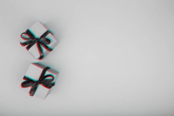 Craft box with red ribbon bow. Valentine day concept. Trendy minimalistic flat lay design background. Horizontal. Glitch effect, black and white - Fotó, kép