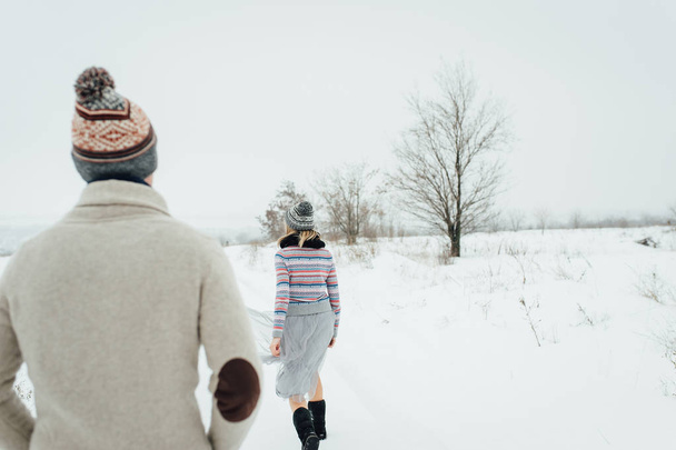 Happy Young Couple in Winter Park having fun.Family Outdoors. love - Фото, изображение