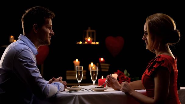 Couple having romantic dinner in high-quality restaurant, evening for two, date - Foto, Imagem