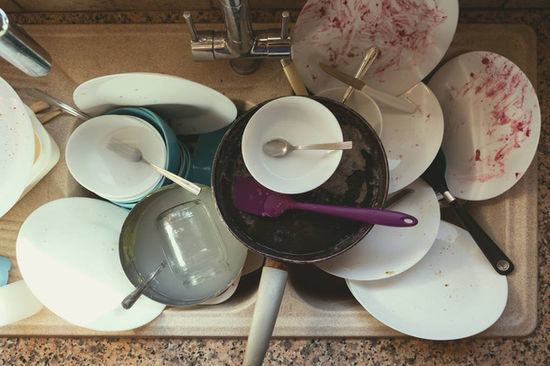 A Messy Pile of Dirty Dishes And Utensils In Kitchen Sink - Fotografie, Obrázek