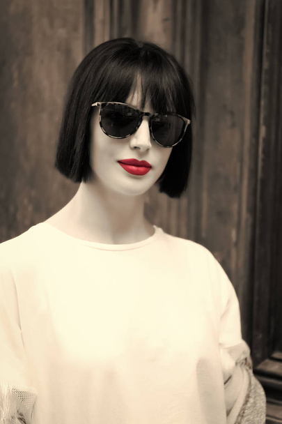 Girl in fashionable glasses and shirt. - 写真・画像