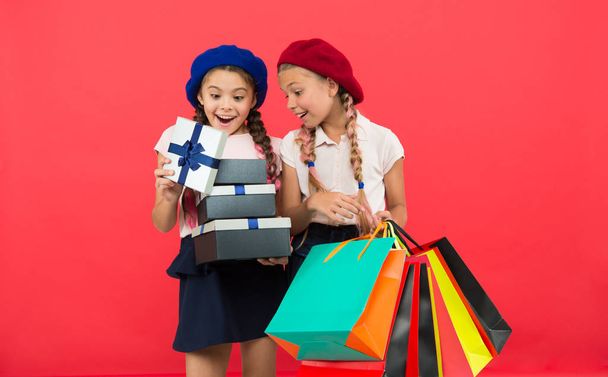Shopping and holidays. For my dear friend. Girl giving gift box to friend. Girls friends celebrate holiday. Children formal wear with gift box. Open gift now. Friendship concept. Birthday present. - Foto, Imagen