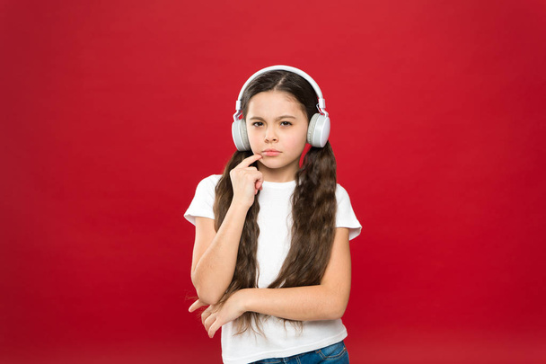 Powerful effect music teenagers their emotions, perception of world. Girl listen music headphones on red background. Play list concept. Music taste. Music plays an important part lives teenagers - Fotoğraf, Görsel