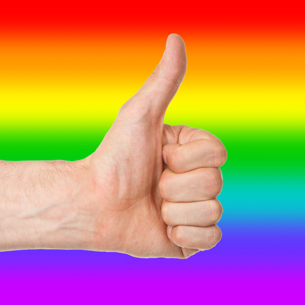 Изображение руки человека, показывающего большой палец вверх, радужный флаг
 - Фото, изображение