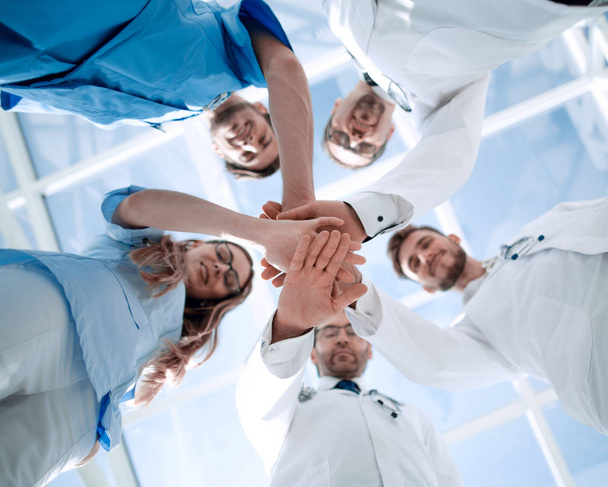 Portrait of a doctor team connecting hands stacking - Foto, Imagem