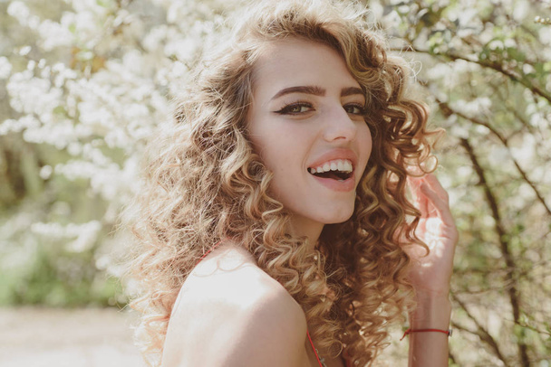 Perfect smile. Happy spring woman. Perfect smiling on sunny background. Beauty and perfect smile. - Photo, Image