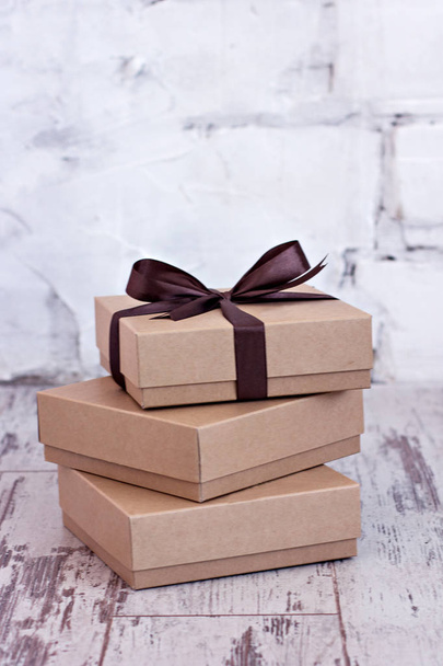Kraft boxes with gifts. - Фото, изображение