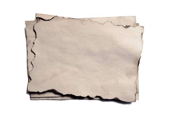 Few old blank pieces of antique vintage crumbling paper manuscript or parchment horizontally oriented isolated on white - Foto, immagini