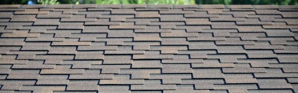 Modern roofing and decoration of chimneys. Flexible bitumen or slate shingles in rectangular shape in perspective. - Photo, Image