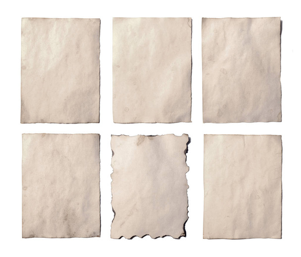 Set of old blank pieces of antique vintage crumbling paper manuscript or parchment vertically oriented isolated on white - Photo, Image