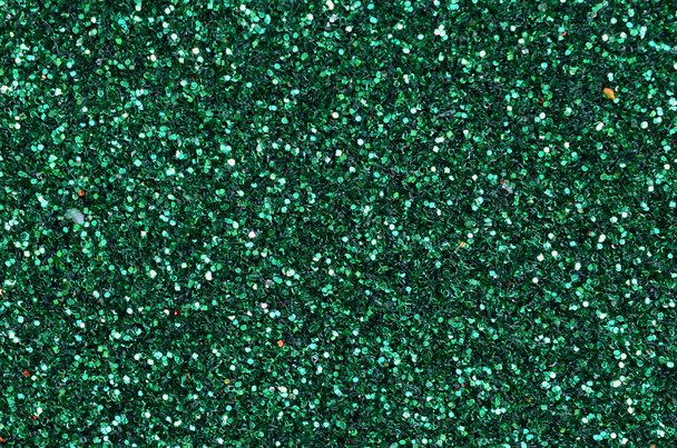 Barevné rozostřeného smaragdově zelené pozadí s třpytivých a šumivé skvrnami. Slavnostní abstraktní Vánoční pozadí pro sváteční sezóny - Fotografie, Obrázek