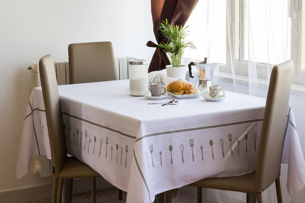 Italian breakfast at home is ready: coffee, croissant, moka, sugar on the table. - Foto, Imagem
